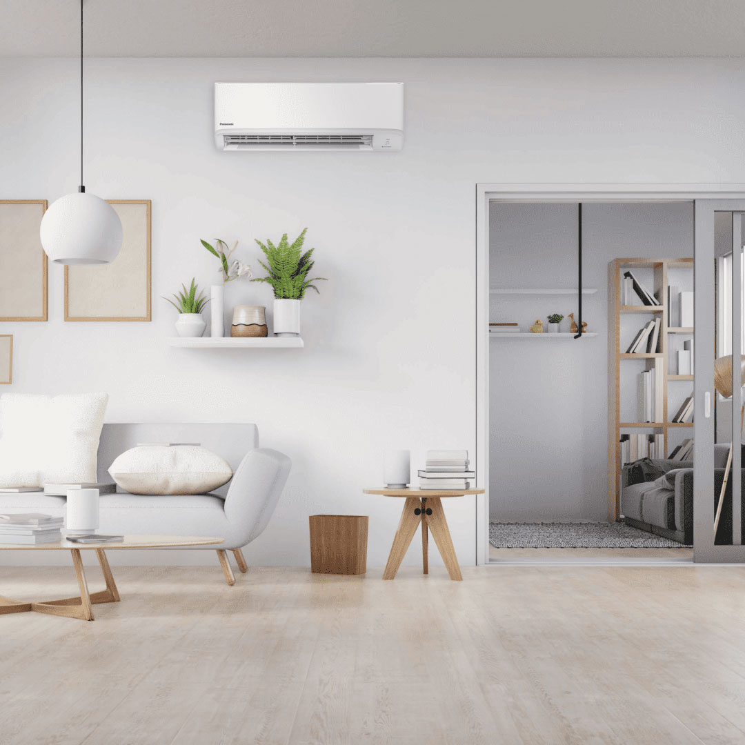 Modern living room with a mounted split system air conditioner.