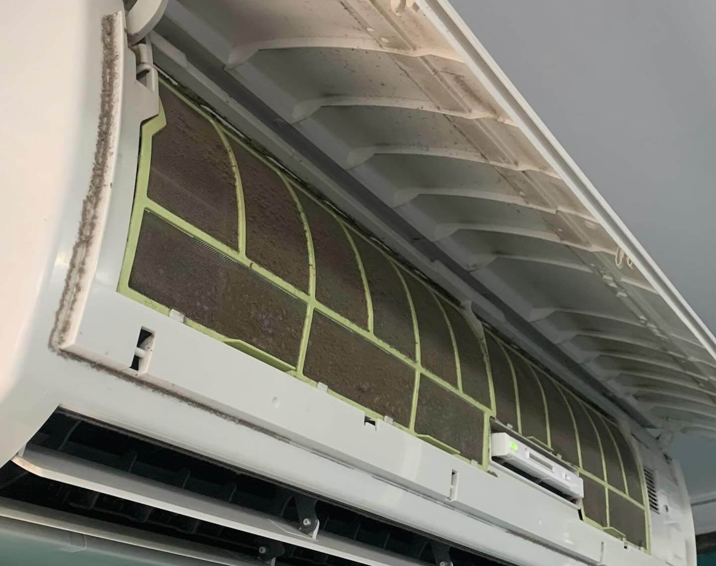 Close-up of air filters covered in dust before servicing.