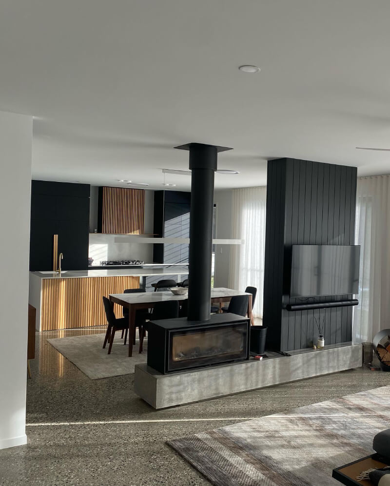 Contemporary living space with ducted air conditioning unit installed.
