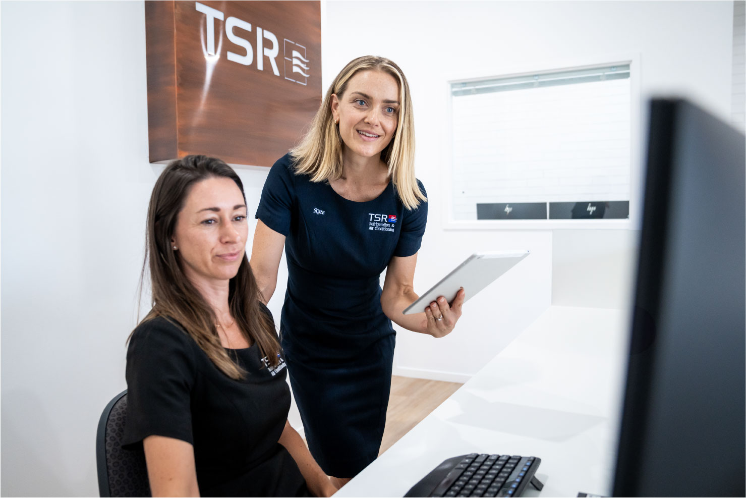 TSR team members consulting inside the office.