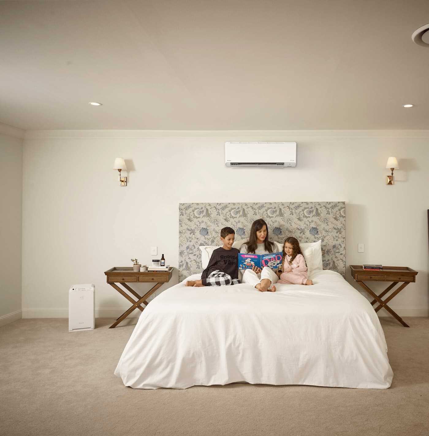 Family reading in air-conditioned bedroom.